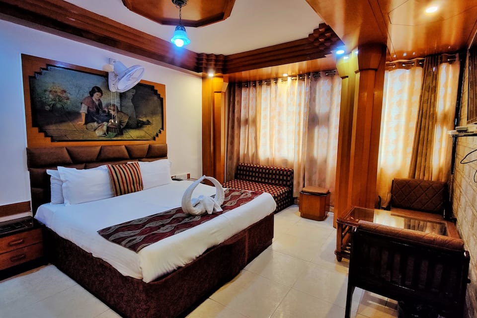 These are Valley view big rooms with Sofa cum bed and huge wardrobe Spacious rooms with ventilation window valley view LED new renovated washrooms with hot water rain shower