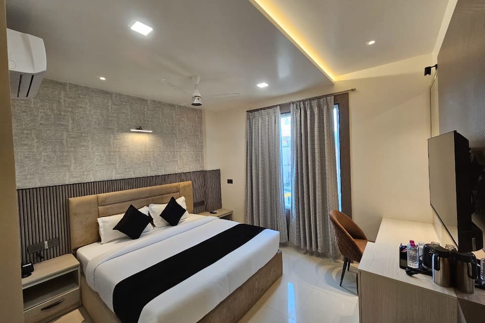Our Premium City View Rooms offer breathtaking panoramic views of the city skyline through large floortoceiling windows providing a luxurious space to relax with a kingsized bed plush seating