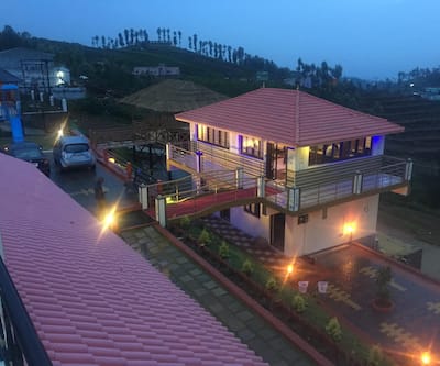 https://imgcld.yatra.com/ytimages/image/upload/t_hotel_yatra_city_desktop/v1572620982/Hotel/Ooty/00074643/hotel-rainy-evening1_aJb9uo.jpg